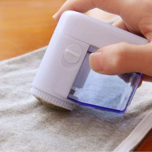 Одстранувач на текстилни топчиња и влакна од облека